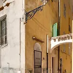 Between The Roofs Of Old Town And The Sea