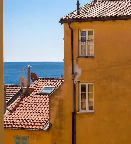 Between The Roofs Of Old Town And The Sea